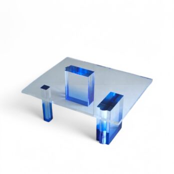 Design coffee table in transparent acrylic with blue shades