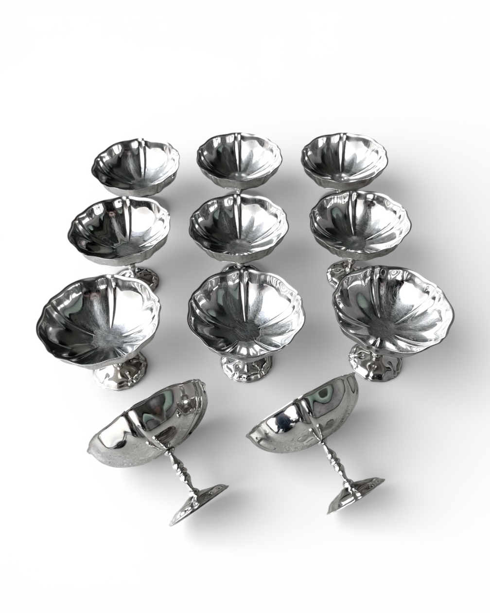 Set of 11 vintage cups in machined steel